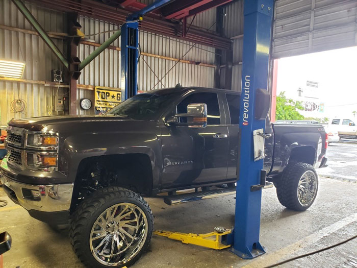 Black Silverado with custom wheels